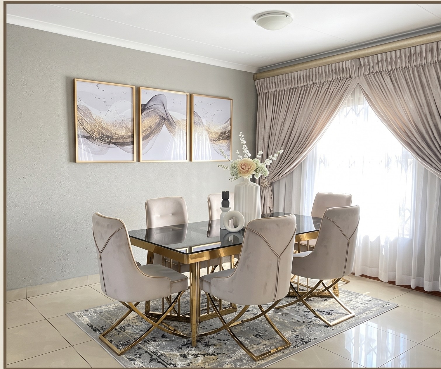 Elegant dining room with gold and glass table after Nto Interiors transformation